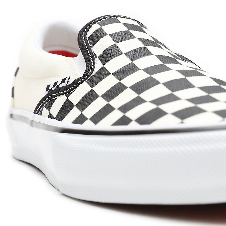 Tan checkerboard shop slip on vans